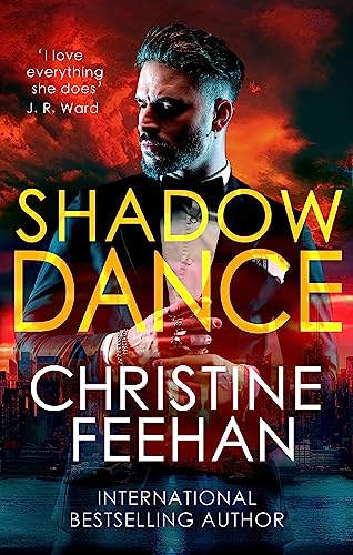Book cover: man in suit, shadowed face, fiery cityscape background.