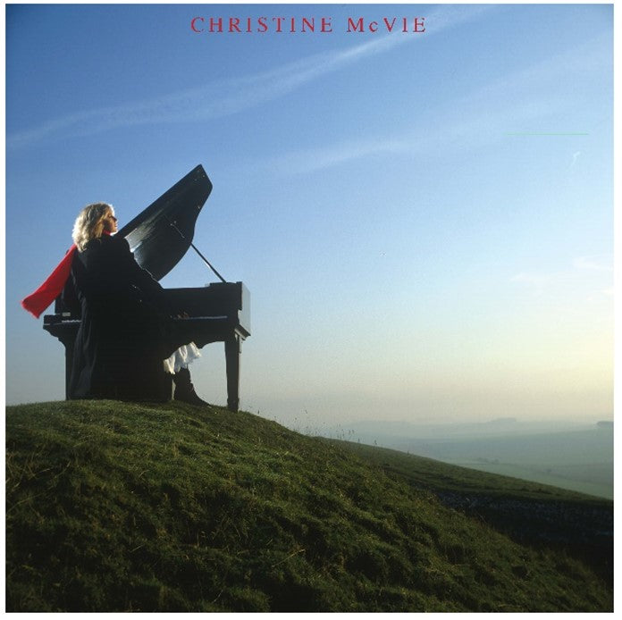 Christine McVie album cover: woman playing piano on a grassy hill.