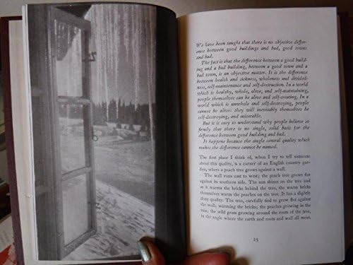 Open book displaying a black and white photograph of a doorway.