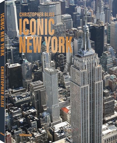 Aerial view of the Empire State Building and surrounding New York City skyscrapers.