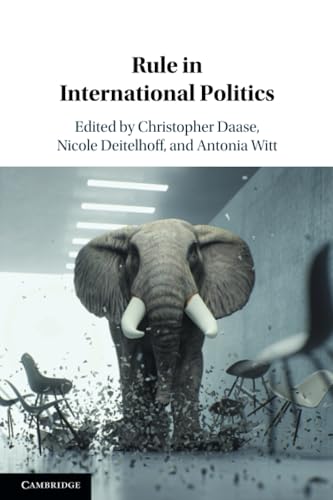 Book cover: elephant walking through shattering chairs, titled "Rule in International Politics".