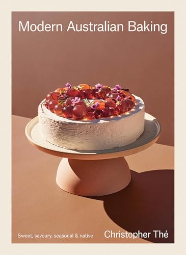 Book cover featuring a white cake topped with red fruit on a stand.