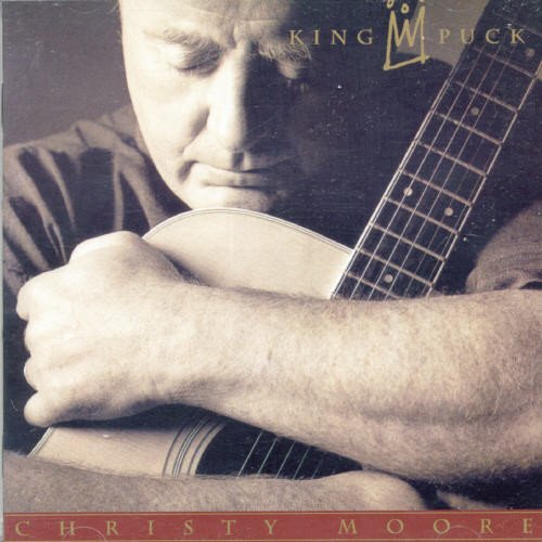 Christy Moore album cover, close-up of a man with a guitar.