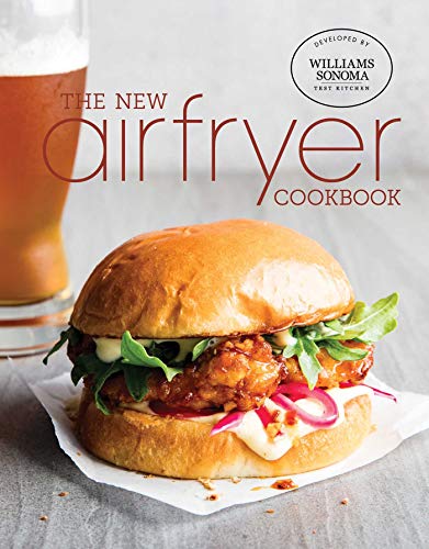 Cookbook cover with a fried chicken sandwich and glass of beer.