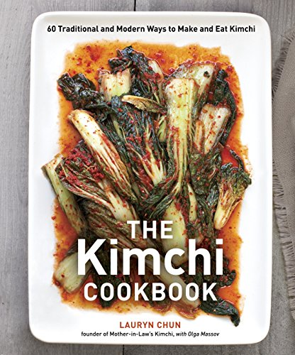 Cookbook cover featuring a white dish piled high with vibrant red kimchi.