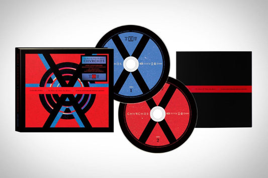 "CD case with red cover and two CDs, one blue and one red."
