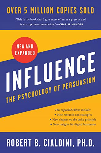 Book cover: "Influence" by Robert Cialdini, with blue, yellow, and red design.