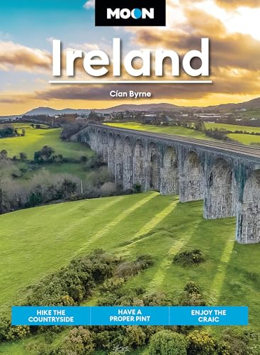 Travel guidebook cover featuring an arched stone bridge over green Irish hills.