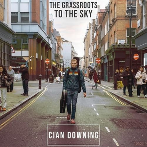 Album cover: Cian Downing with guitar on a city street.