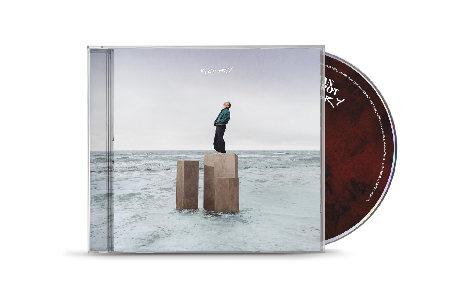 CD case for Cian Ducrot’s “Victory,” featuring a man on pillars by the sea.