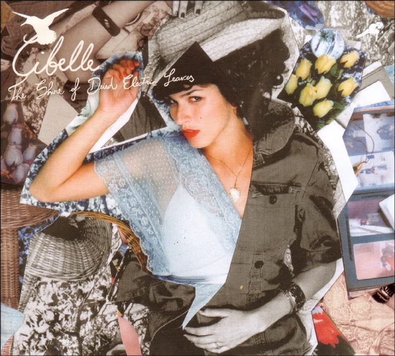 CD cover for Cibelle, featuring a woman in a large hat and lace.