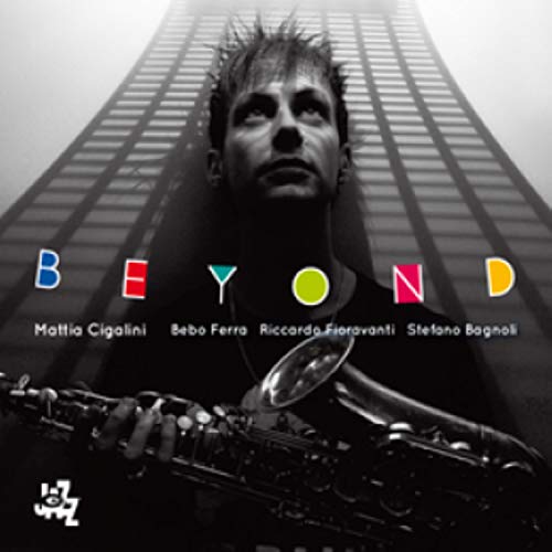 CD cover: Man with saxophone, looking up at tall buildings.