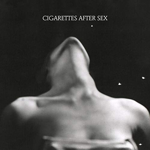 Black and white album cover with a blurred image of a person’s face.