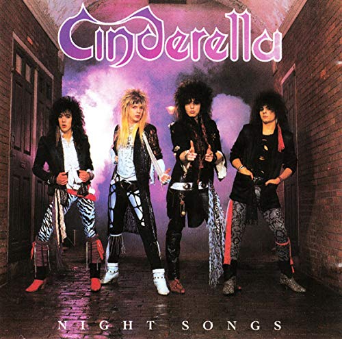 Four band members with teased hair pose in a brick alleyway on the album cover.