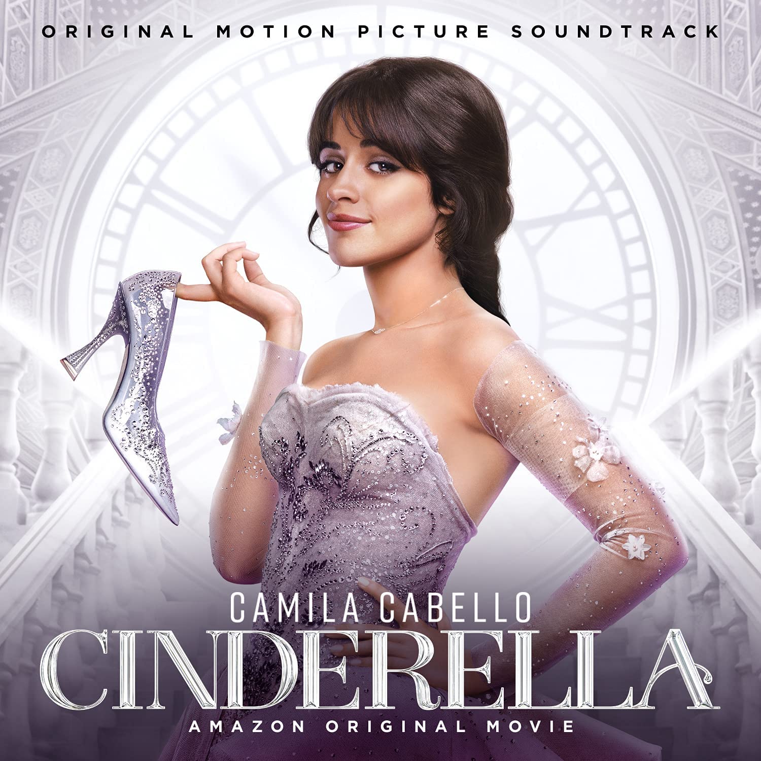 Camila Cabello holds a sparkling glass slipper in front of a large clock background.
