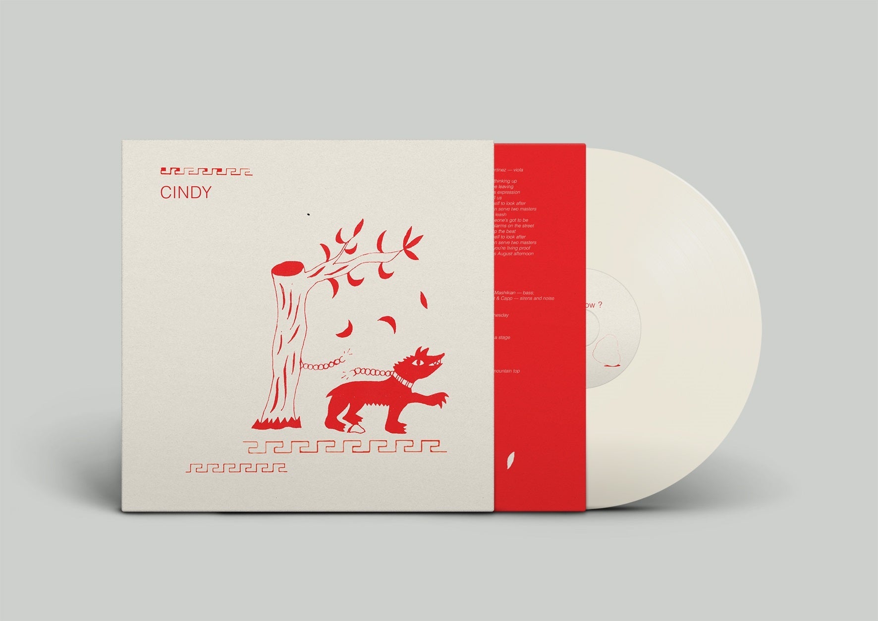 Vinyl LP record with a tan cover featuring a red cartoon monster.