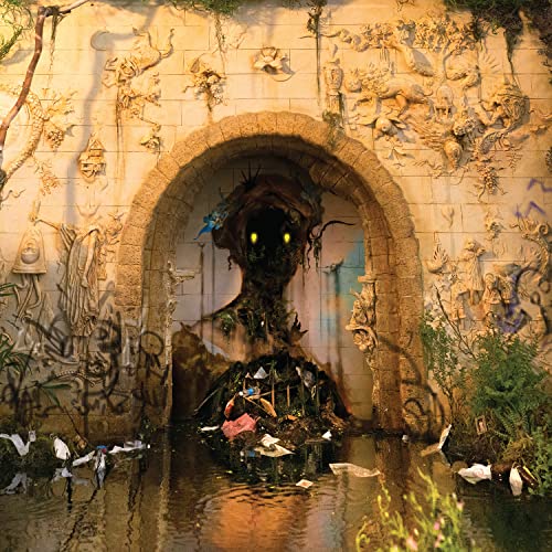 Album cover: stone archway with a shadowy, floral figure inside.