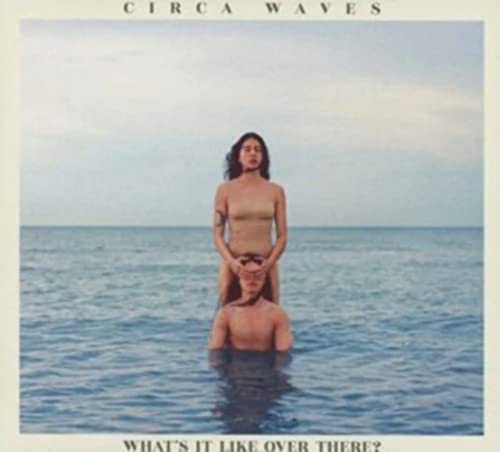 Album cover showing one person standing behind another in the ocean.