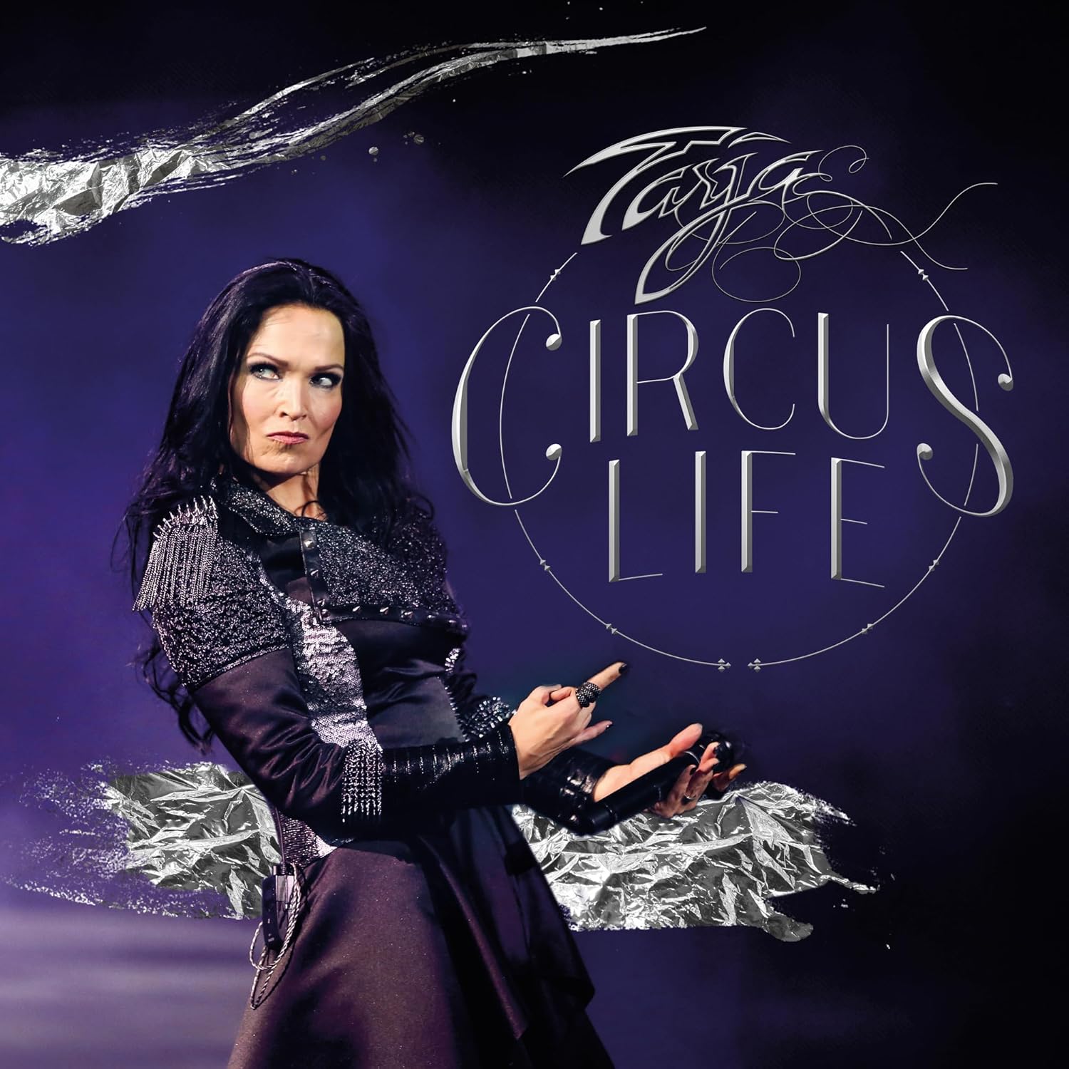 Tarja Turunen performing on stage with the text Circus Life against a dark background.