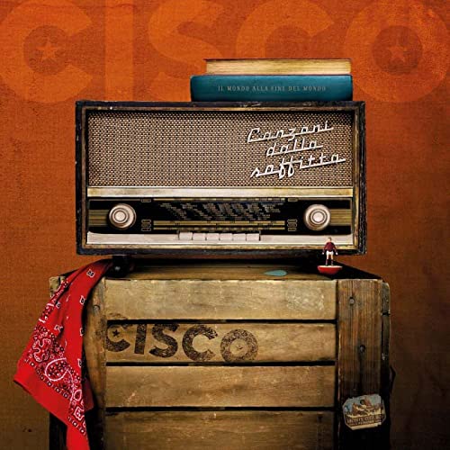 Album cover: vintage radio, books, and a small figure on a crate.