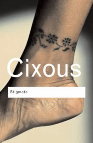 A close-up of an ankle with a floral tattoo, featuring text reading Cixous Stigmata.