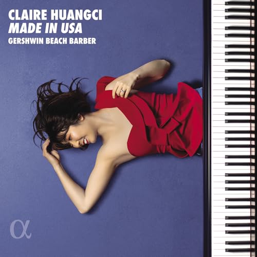 CD cover featuring a woman in red and a piano keyboard.