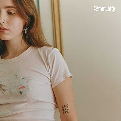 Clairo album cover, close-up of a young woman with text "Immunity".