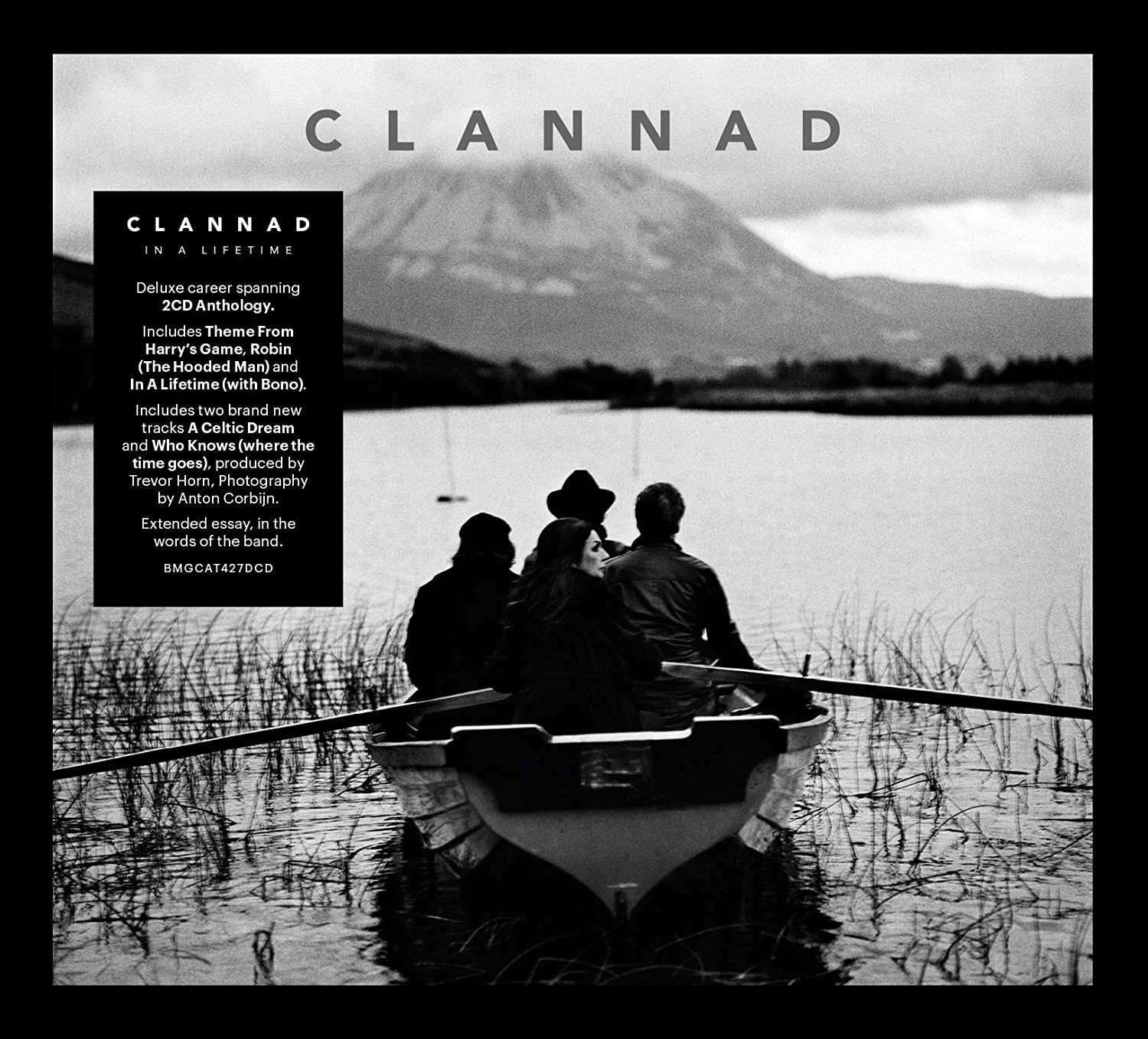 "Black and white album cover with men in a boat on a lake."