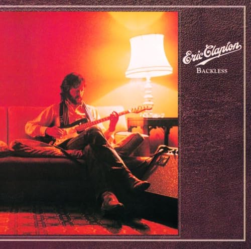 Eric Clapton sitting with a guitar, album cover for "Backless.