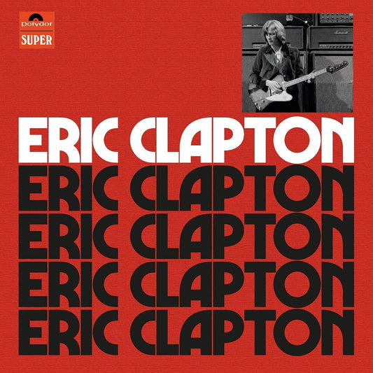 Red Eric Clapton anniversary CD box set with booklet and four discs.