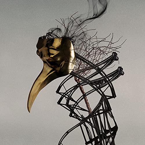 Golden plague doctor mask with smoke and abstract wire structure.