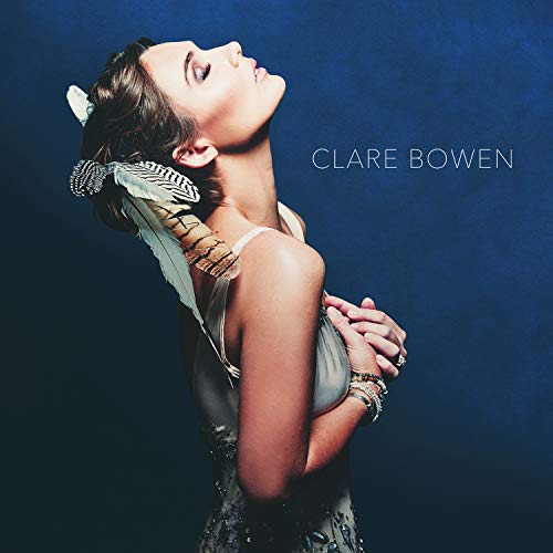 Clare Bowen album cover featuring a woman looking upwards with feather adornments.