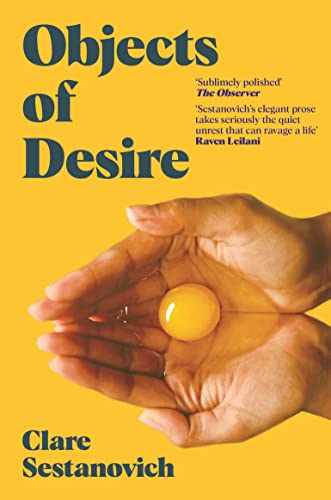 Book cover: "Objects of Desire" with a hand holding a yellow yolk.