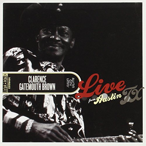 Black and white photo of Clarence Gatemouth Brown playing guitar on stage.