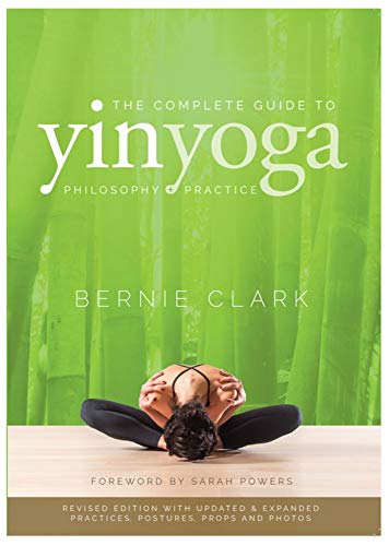 Book cover featuring a person in a seated Yin Yoga pose, green bamboo background.
