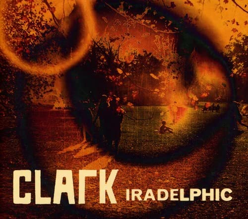 CD cover for Clark’s “Iradelphic” featuring a fiery, surreal landscape.