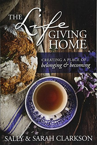 Book cover with bread, teacup, flowers, and white cursive title.