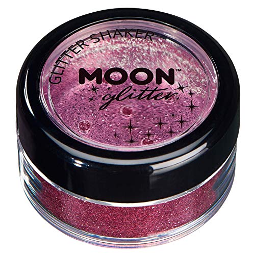 A small, round jar filled with pink cosmetic glitter featuring a black screw-top lid.