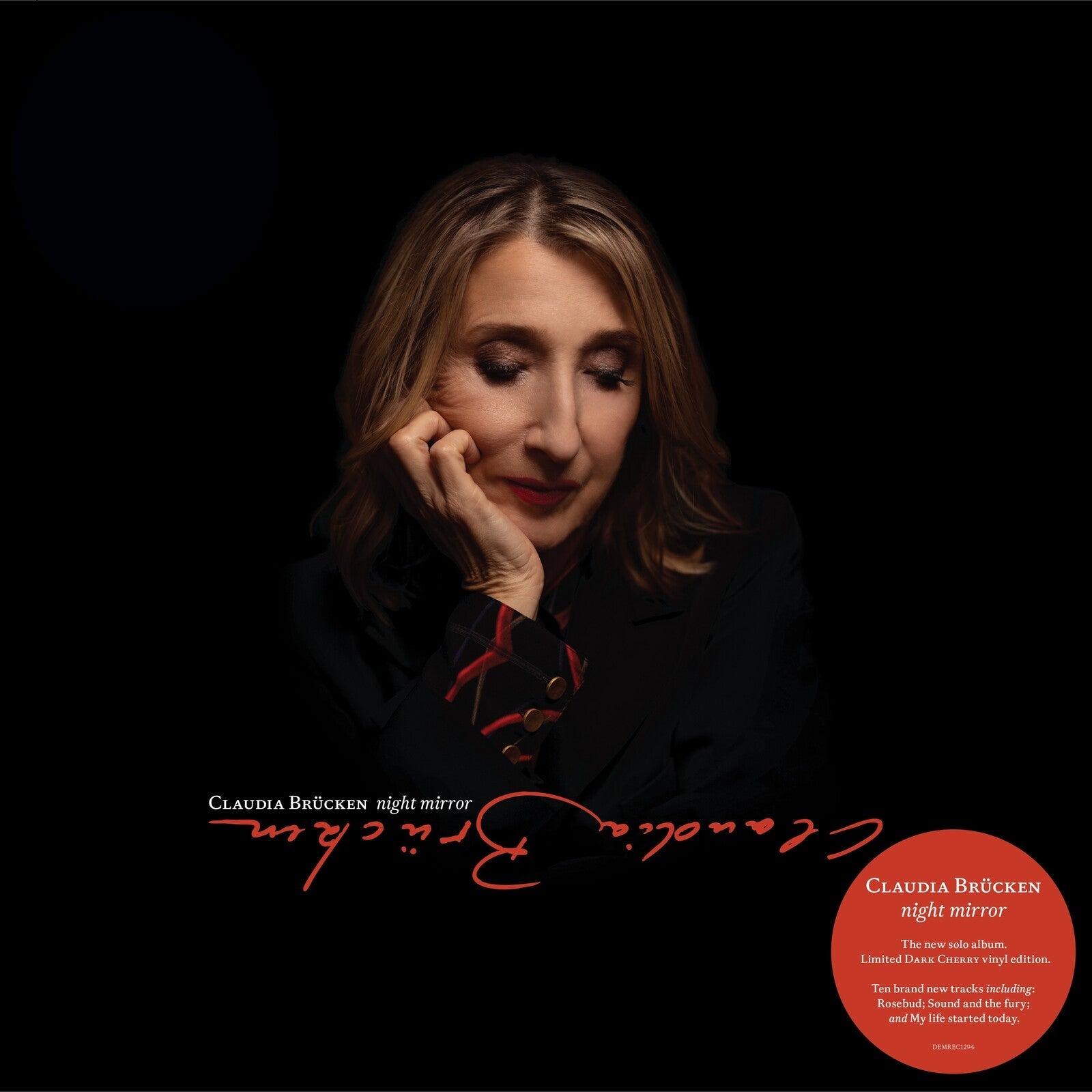 Claudia Brucken album cover, portrait of a woman with red details.