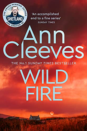 A book with a rugged landscape or fiery design on its cover.