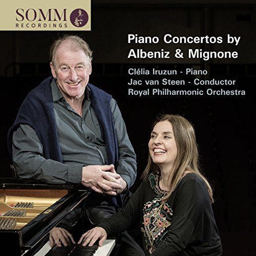 CD cover featuring a man and woman near a piano, with text overlay.