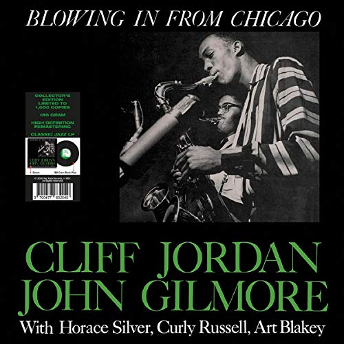 Album cover featuring two jazz musicians playing saxophones, black background.