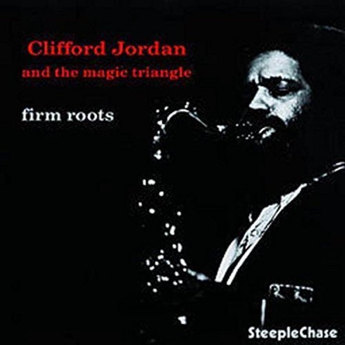 Vinyl album cover with a man playing saxophone against a black background.