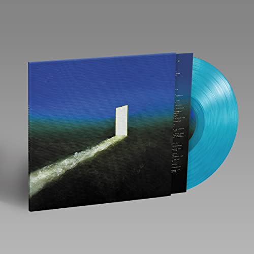 Blue vinyl record with album cover featuring a white monolith landscape.
