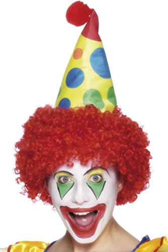 A person dressed as a clown, wearing a red wig and a yellow polka-dot hat.