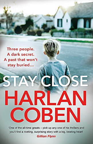 Book cover showing a young boy walking down a suburban street away from camera.