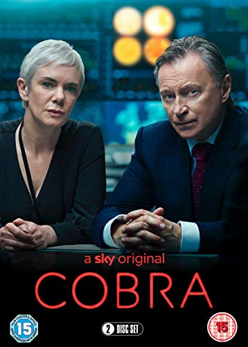 DVD cover for "Cobra" featuring two serious-looking people in suits.