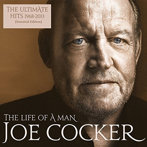 Close-up portrait of Joe Cocker, a bearded man with blue eyes.