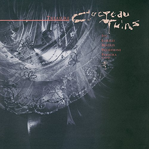 Album cover for Cocteau Twins Treasure featuring a person in a lace dress.