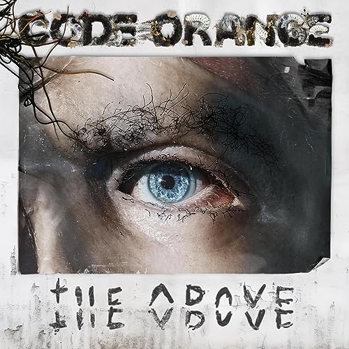 Album cover featuring a close-up of a blue human eye with dark hair strands.